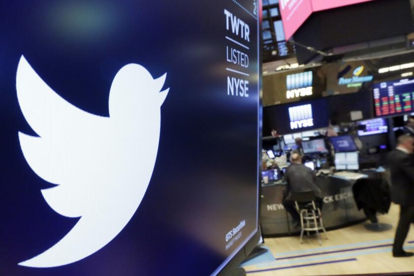 FILE - In this Feb. 8, 2018 file photo, the logo for Twitter is displayed above a trading post on the floor of the New York Stock Exchange. Twitter Inc., on Friday, July 27 reported second-quarter net income of $100.1 million, after reporting a loss in the same period a year earlier. On a per-share basis, the San Francisco-based company said it had net income of 13 cents. Earnings, adjusted for one-time gains and costs, were 17 cents per share. (AP Photo/Richard Drew, File)