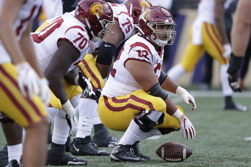 Southern Cal's Brett Neilon lines-up behind the football against Washington in the second half of an NCAA college football game Saturday, Sept. 28, 2019, in Seattle. Washington won 28-14. (AP Photo/Elaine Thompson)