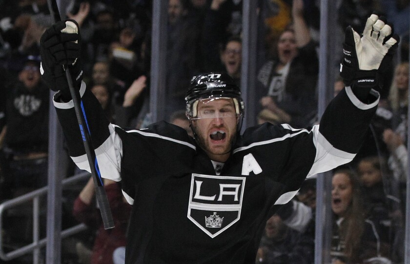 Kings center Jeff Carter celebrates a goal by left wing Milan Lucic (not pictured) against the New York Islanders.