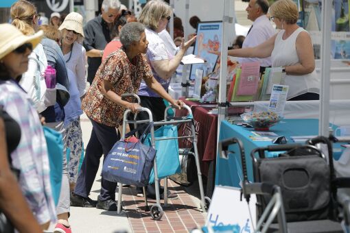 SAN DIEGO, CA 6/9/2018: The booths were busy places for the nearly 4,000 people who visited the CaregiverSD Community Expo at Liberty Station, including the San Diego Elder Law Center booth. Photo by Howard Lipin/San Diego Union-Tribune/Mandatory Credit: HOWARD LIPIN SAN DIEGO UNION-TRIBUNE/ZUMA PRESS