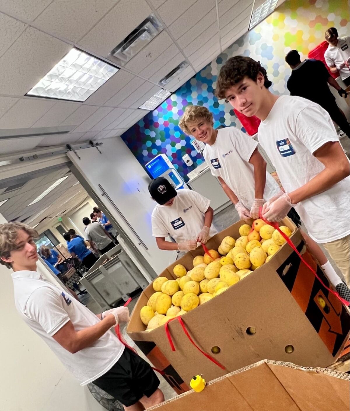 The La Jolla chapter of the National League of Young Men recently participated in a charity event with Feeding San Diego.