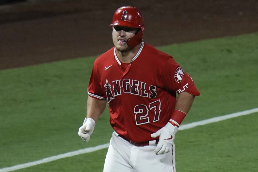Los Angeles Angels' Mike Trout rounds the bases after hitting a two-run home run.
