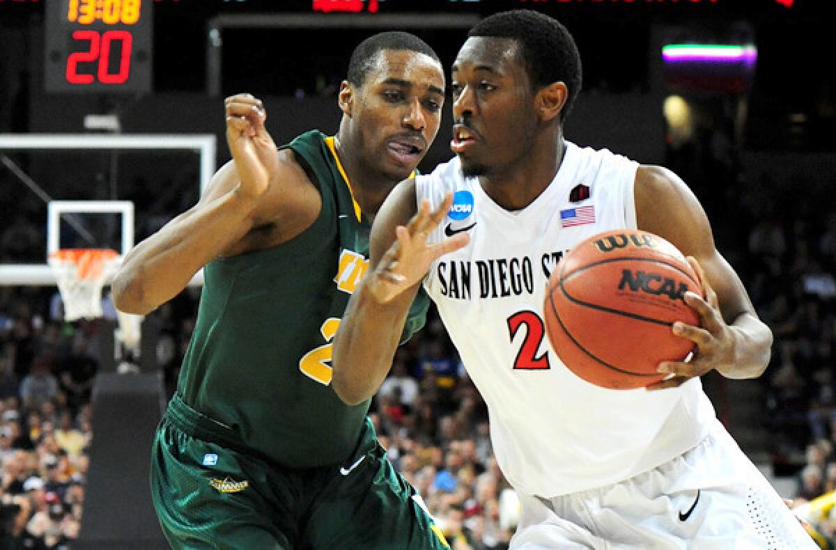 San Diego State guard Xavier Thames drives against North Dakota State guard Kory Brown in third-round game of the NCAA tournament on Saturday in Spokane.