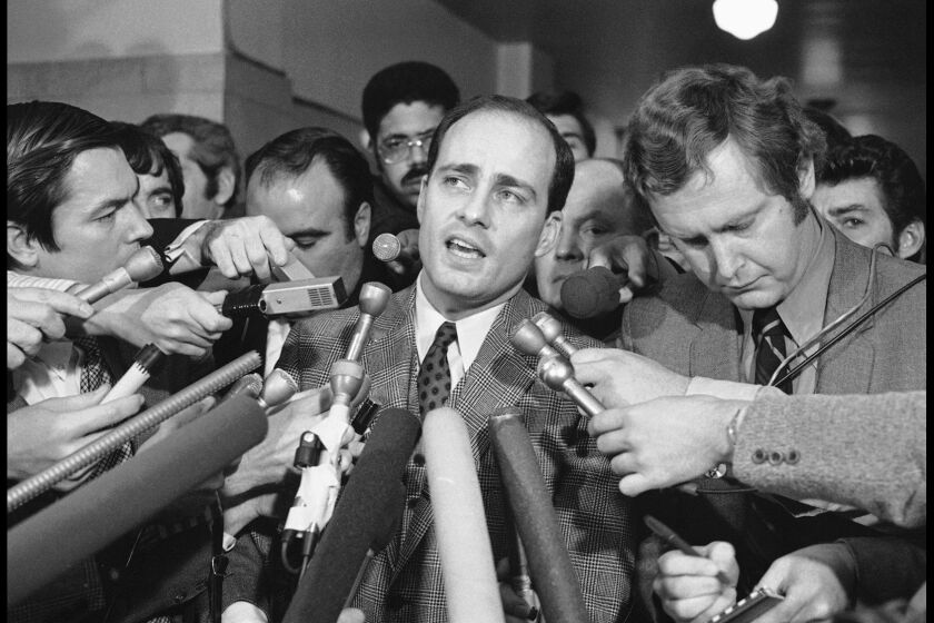 Vincent Bugliosi, chief prosecutor in the trial of Charles Manson and three young women, spoke with journalists outside the courtroom in 1971 in Los Angeles.