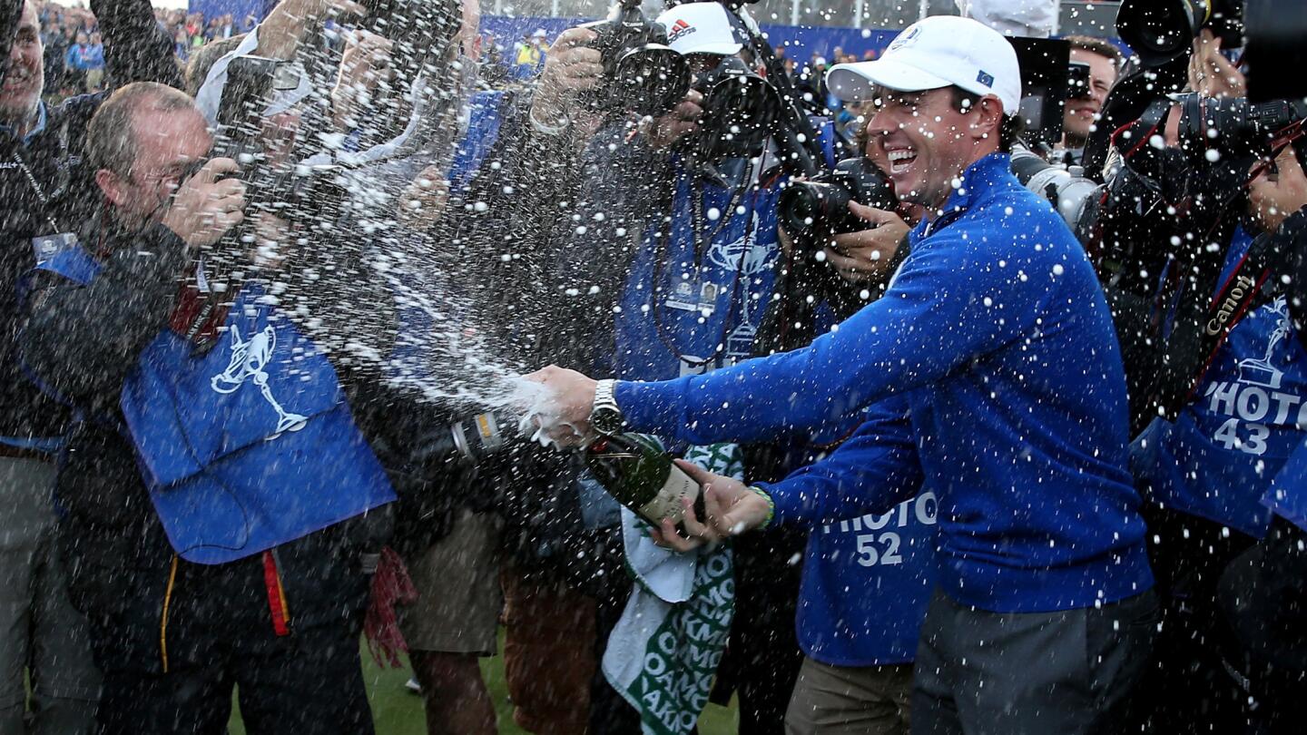 Rory McIlroy sprays champagne as he celebrates Europe's Ryder Cup win over the U.S. on Sunday.