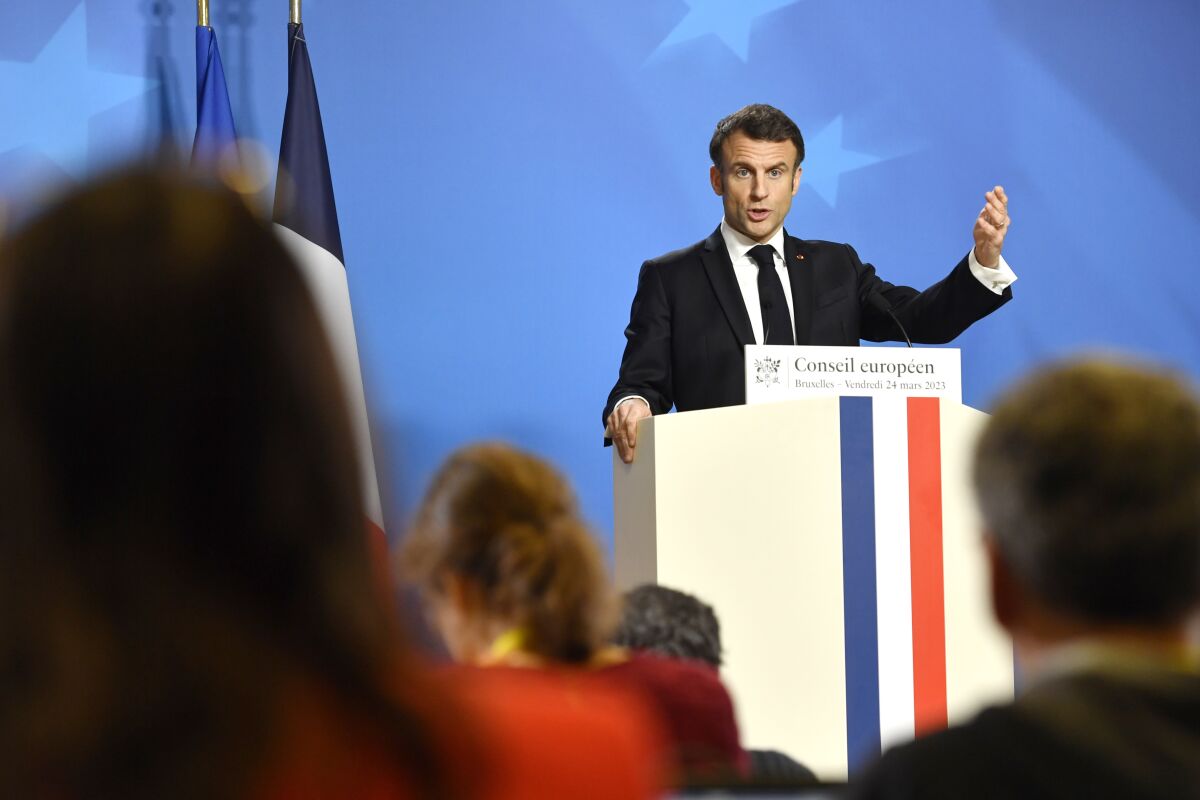 France's President Emmanuel Macron speaks during a media confernce at an EU summit in Brussels, Friday, March 24, 2023. European leaders gathered Friday to discuss economic and financial challenges and banking rules, seeking to tamp down concerns about eventual risks for European consumers from banking troubles in the US and Switzerland. (AP Photo/Geert Vanden Wijngaert)