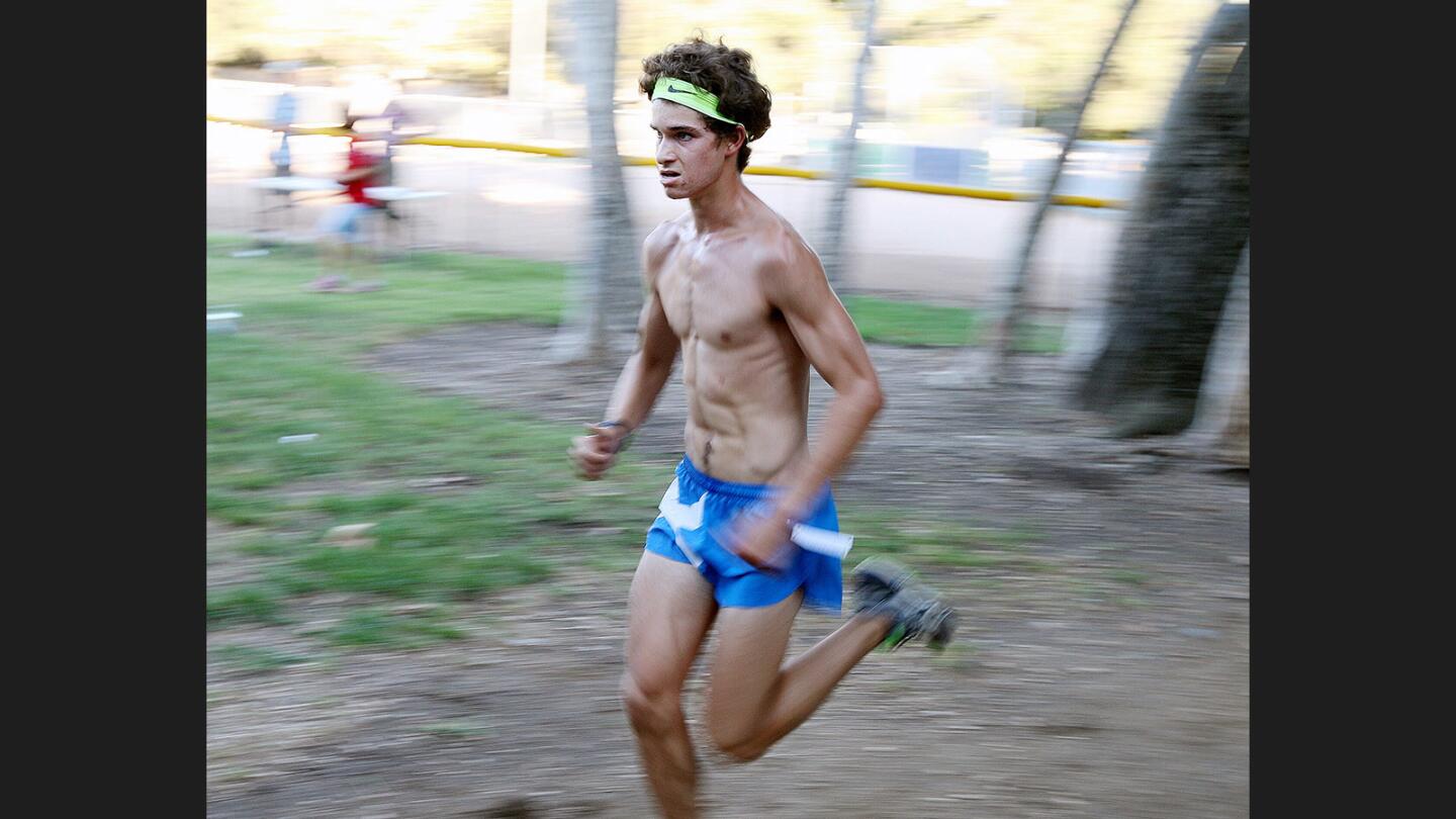 Crescenta Valley’s Colin FitzGerald midway on the course and a long way in first place, in the 3-mile race for the Crescenta Valley Summer Race Series at Crescenta Valley Regional Park on Wednesday, July 26, 2017.