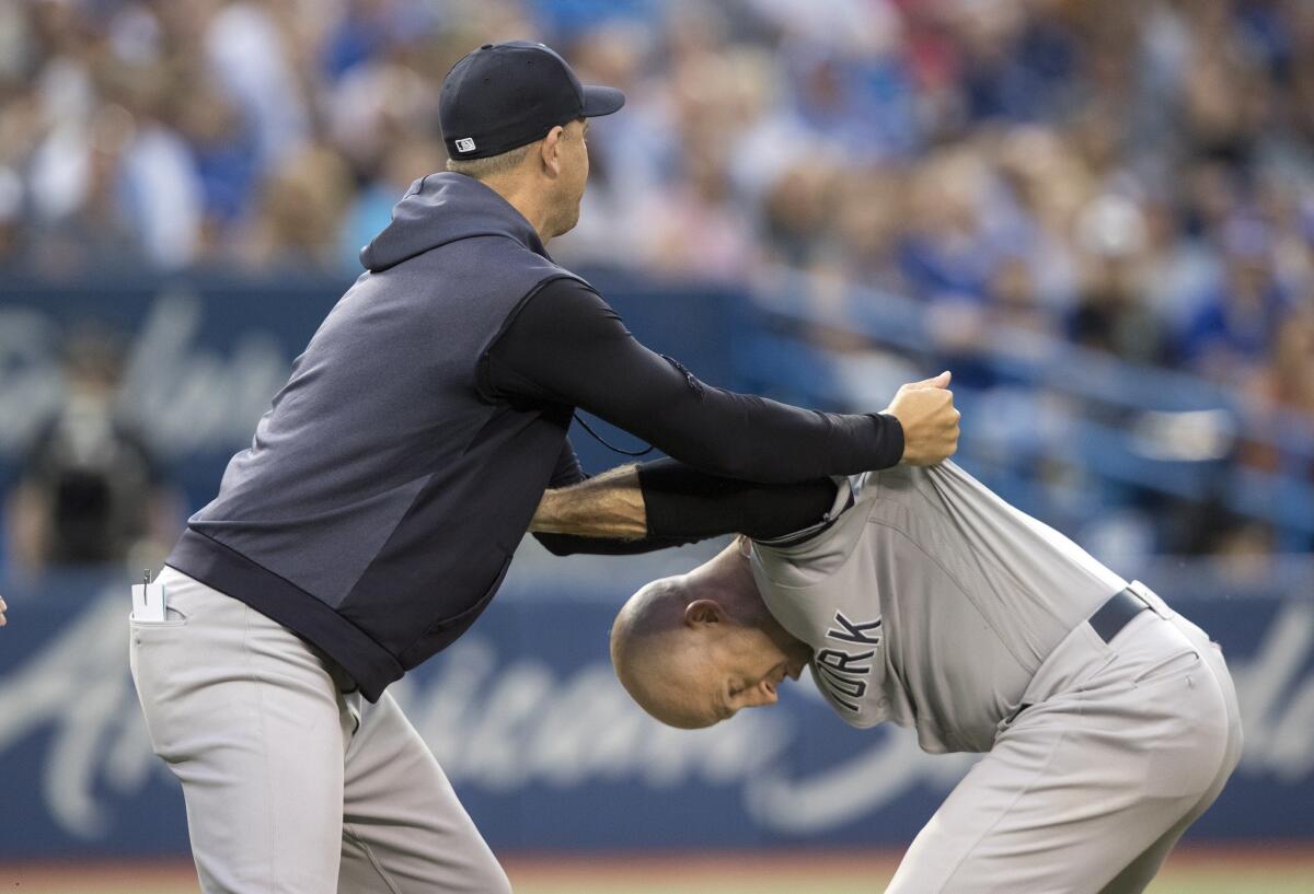 Yankees OF Brett Gardner restrained from going after umpire