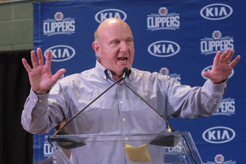 From left, Los Angeles Clippers team chairman Steve Ballmer introduces Paul George and Kawhi Leonard at a press conference at the Green Meadows Recreation Center in Los Angeles, Wednesday, July 23, 2019. (AP Photo/Ringo H.W. Chiu)