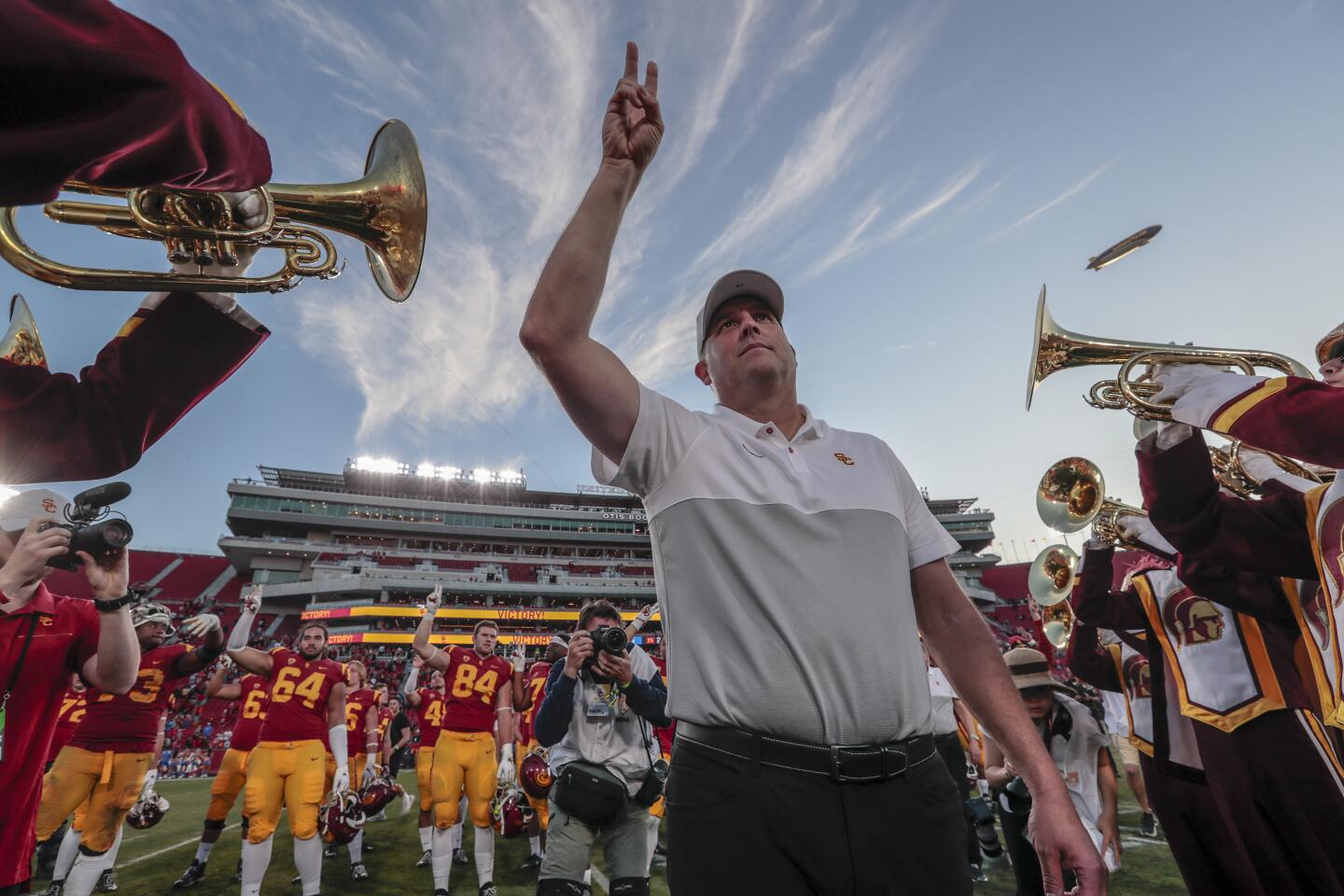 USC head coach Clay Helton celebrates after a 52-35 win over UCLA at the Coliseum.