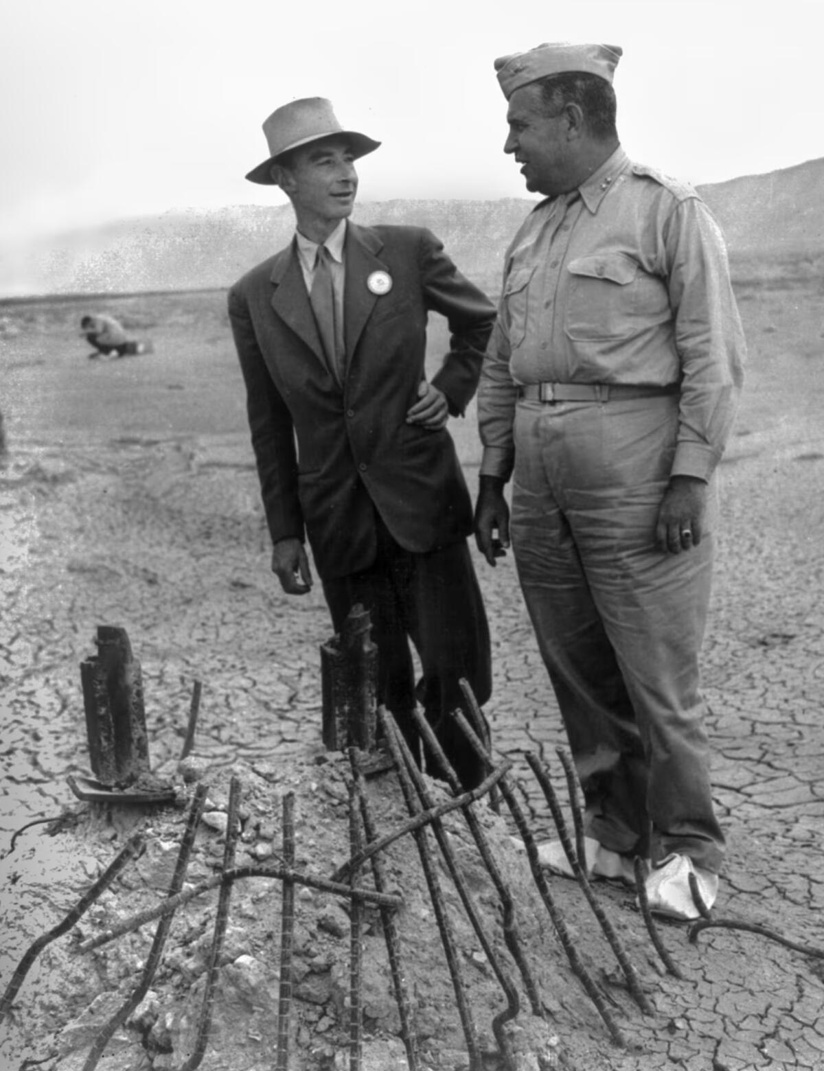 J. Robert Oppenheimer and Gen. Leslie Groves on a plutonium bomb test site