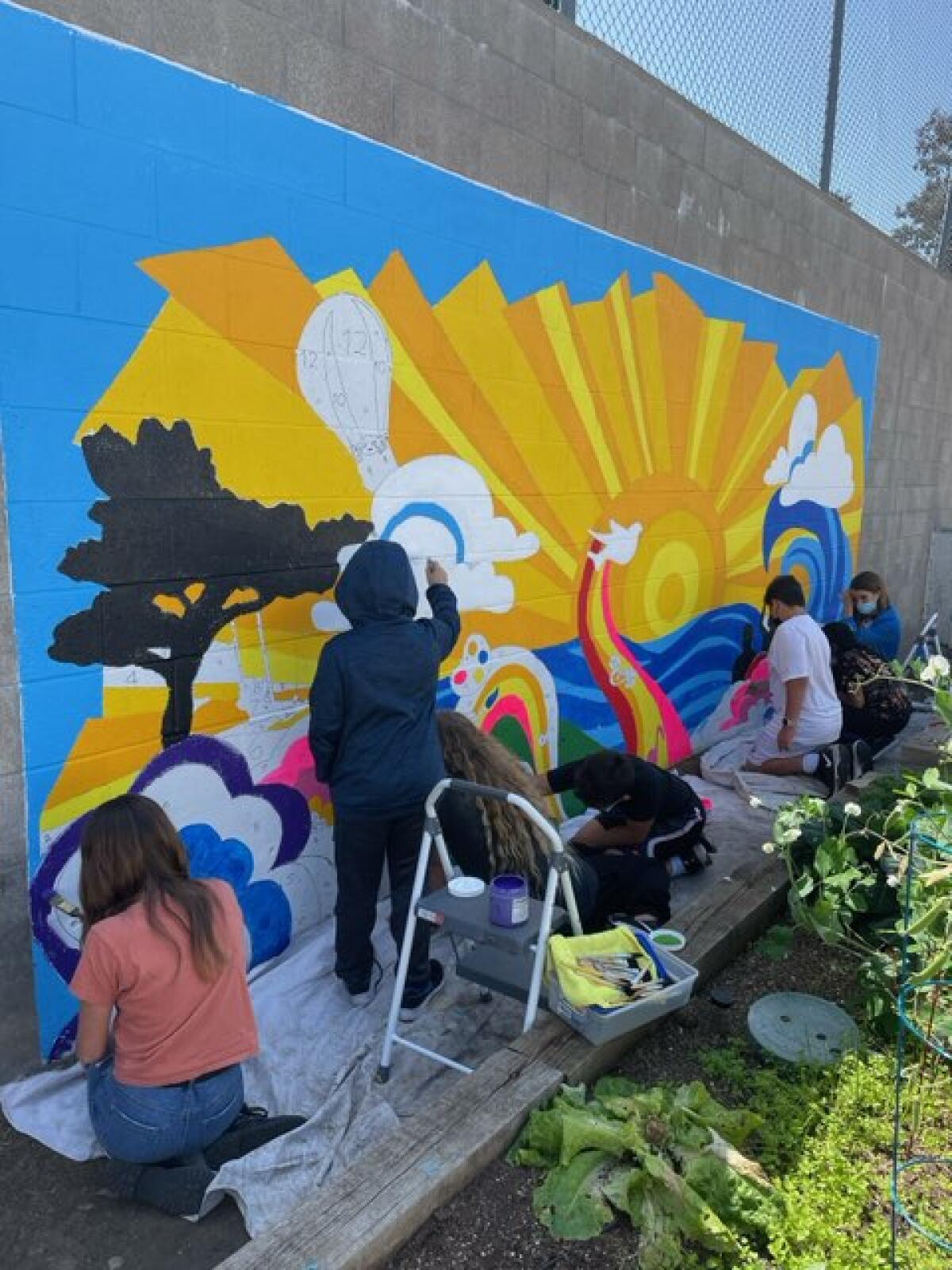 Students completed the mural "paint by numbers" style.