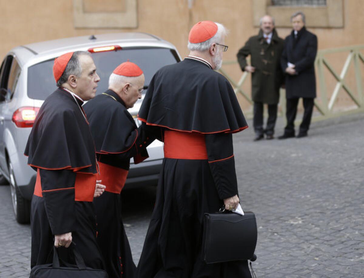 U.S. Cardinals Daniel DiNardo, left, and Sean Patrick O'Malley, right, arrive for a meeting at the Vatican on Wednesday.