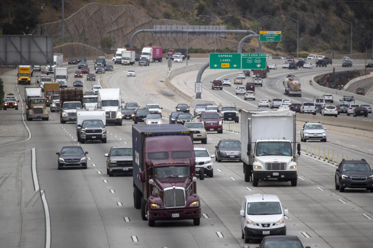 View of traffic on the 91 Freeway and the Green River Boulevard overpass on May 20, 2021 in Corona.