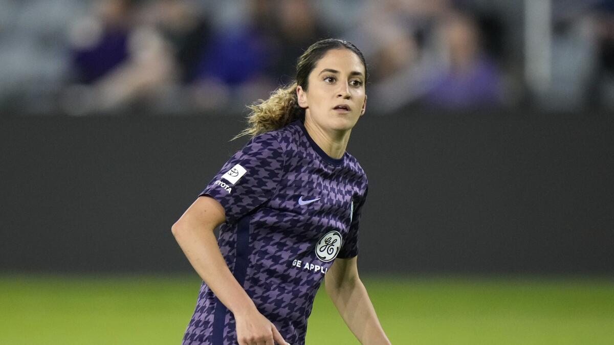 Racing Louisville FC's Savannah DeMelo in action during an NWSL match.