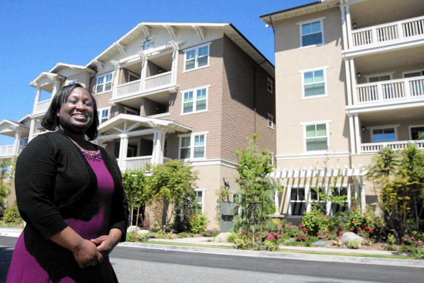 Former homeless U.S. Navy veteran Yolanda Franklin, 39, is all smiles now that she has a place to call her own at the newly-opened Veterans Village of Glendale.