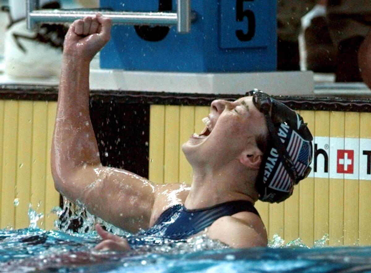 Amy Van Dyken Rouen celebrates after winning the gold medal in the women's 50-meter freestyle at the 1996 Summer Olympics in Atlanta.