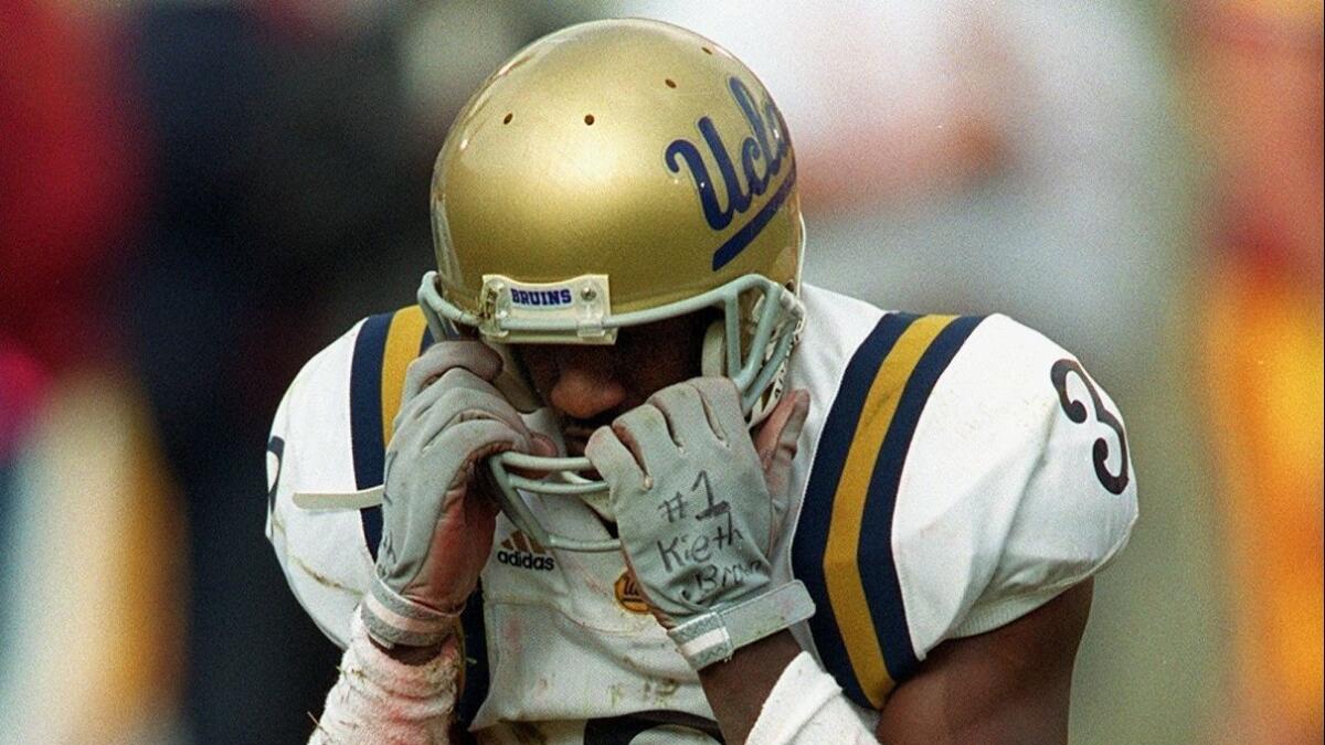 UCLA receiver Freddie Mitchell after dropping a pass in the second quarter, one of two consecutive drops, during game against USC at the Coliseum on Saturday, Nov.20, 1999. USC won 17-7, breaking an eight game losing streak to their crosstown rivals.