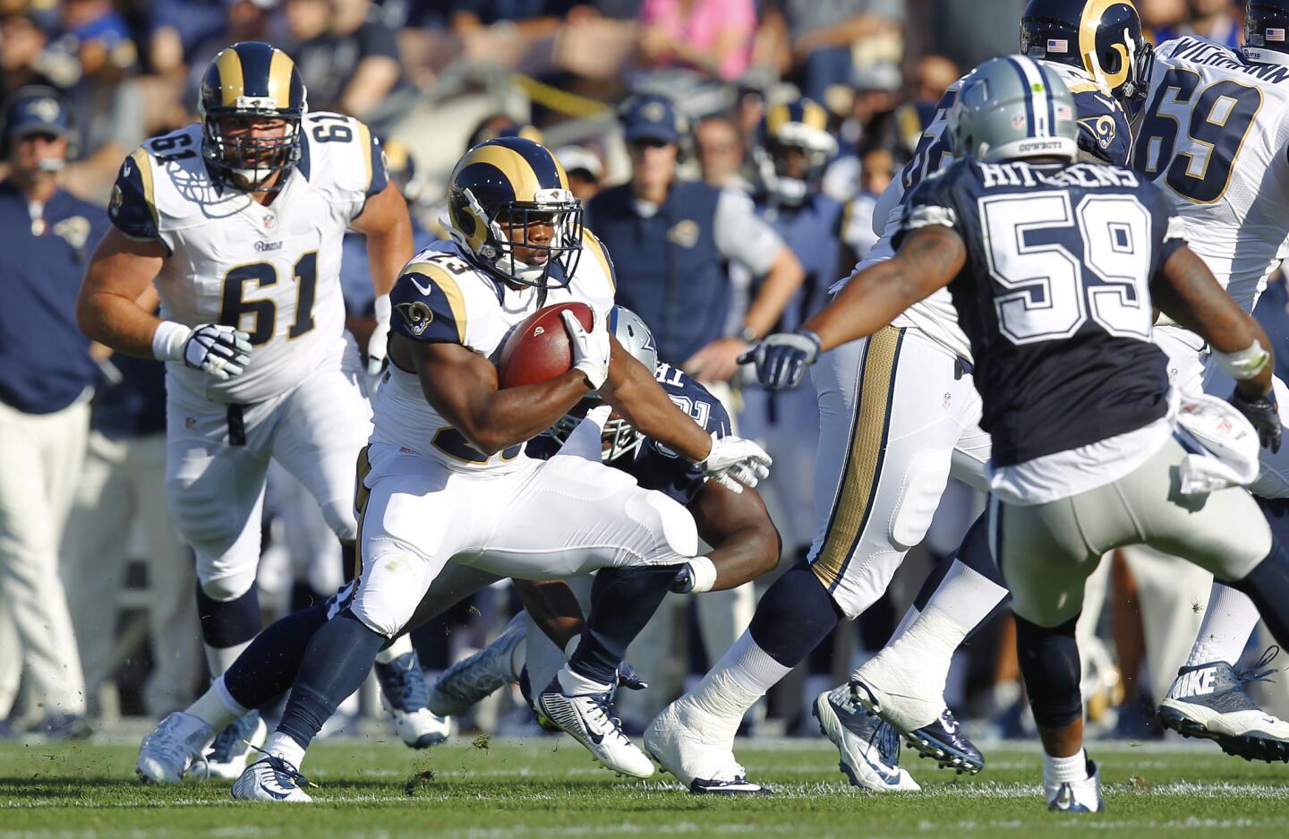 Rams running back Benny Cunningham tries to find a lane in the first quarter of a preseason game against Dallas.