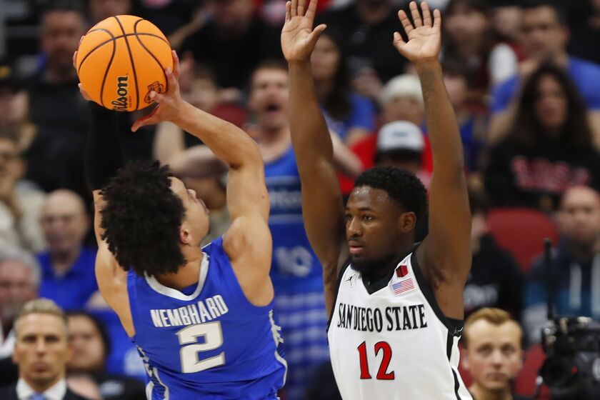Louisville, KY - March 26: San Diego State's Darrion Trammell defends as Creighton's Ryan Nembhard shoots in an Elite 8 game in the NCAA Tournament on Sunday, March 26, 2023 in Louisville, KY. (K.C. Alfred / The San Diego Union-Tribune)