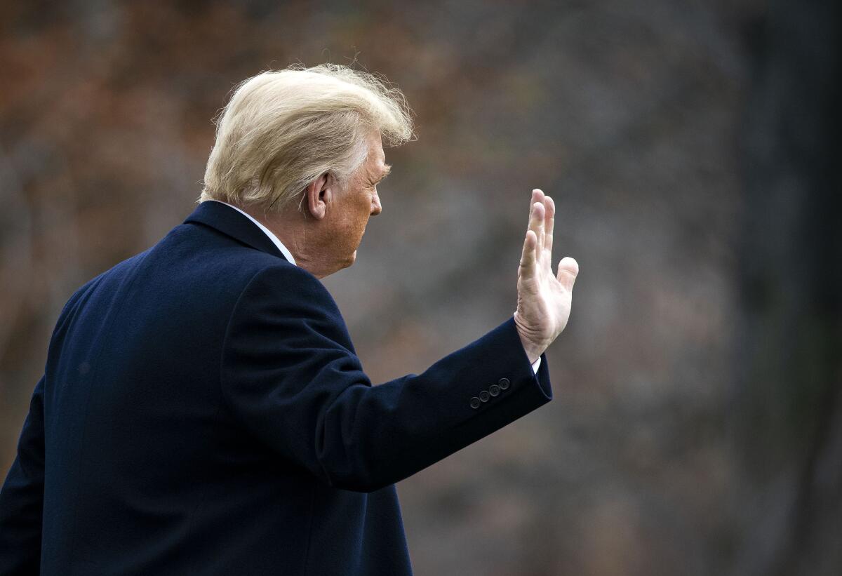 President Trump waves as he departs the White House on Dec. 12, 2020. 