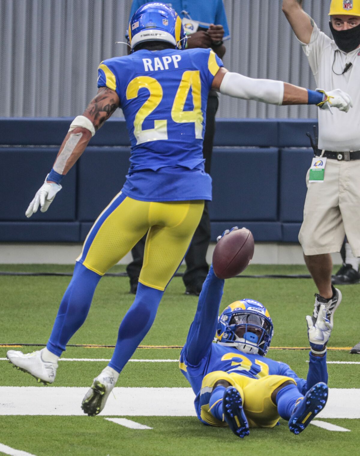 Rams cornerback Darious Williams holds up the ball after intercepting Daniel Jones in the fourth quarter of Sunday's win.