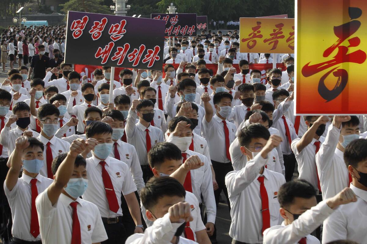 North Korean students march June 8 in Pyongyang to denounce South Korean authorities.