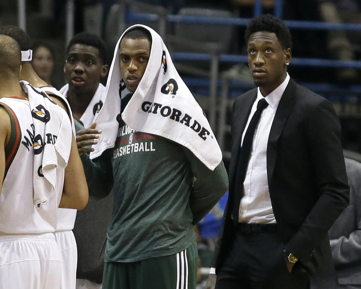 Milwaukee Bucks center Larry Sanders, right, did not suit up against the Phoenix Suns on Jan. 6.