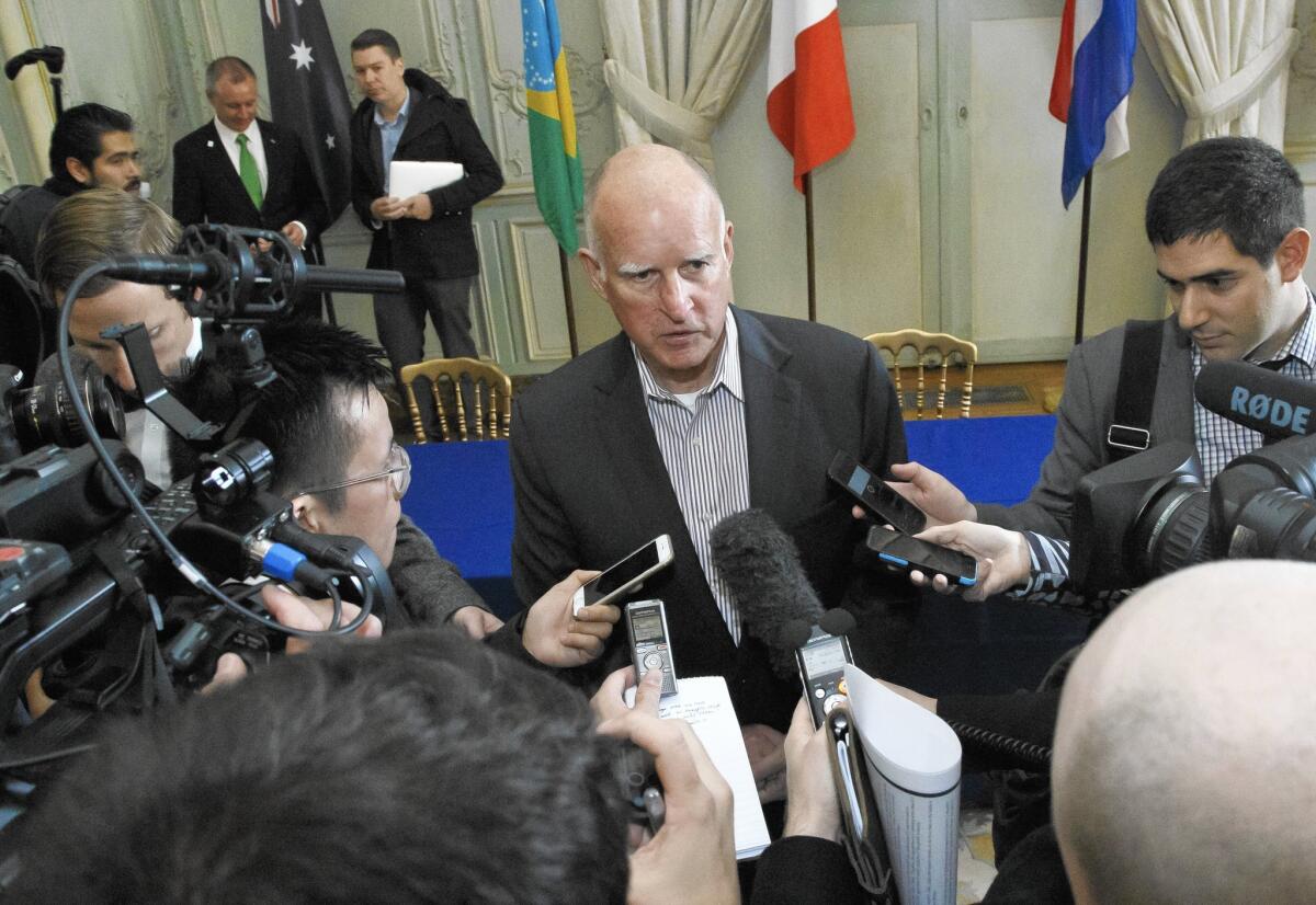 Gov. Jerry Brown at the U.N. Climate Change Conference on Dec. 6 in Paris. Decisions on state issues on health, roads and schools are pushed into the new year.