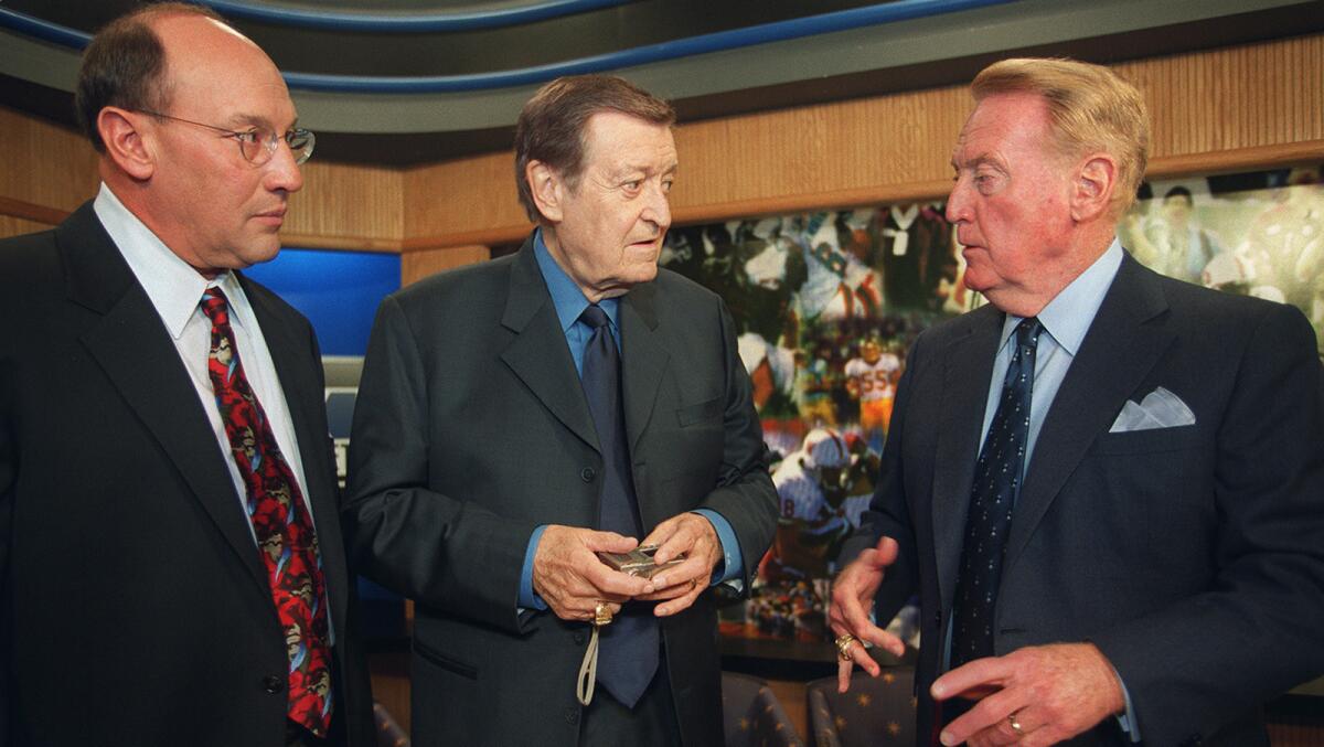 Three legends of Los Angeles sports broadcasting gather for a taping of the Carl's Jr. Sports Roundtable talk show for Fox Sports Network in Century City on Dec. 4, 2000. From left are Bob Miller of the Kings, Chick Hearn of the Lakers and Vin Scully of the Dodgers.