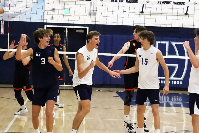 Newport's Harbor's Luca Curci (4) celebrates with his team after he scored during Huntington Beach High School's boys' volleyball team against Newport Harbor High School boys' volleyball team in the CIF Southern Section Division 1 boys' volleyball playoff game at Newport Harbor High School in Newport Beach on Wednesday, April 26, 2023. (Photo by James Carbone)