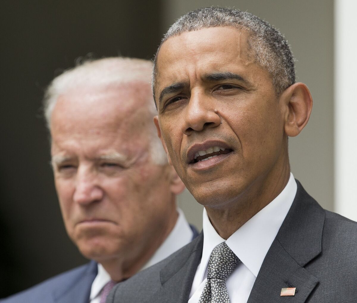 President Obama, accompanied by Vice President Joe Biden, speaks at the White House on June 25, after the U.S. Supreme Court turned aside a legal challenge to the Affordable Care Act.
