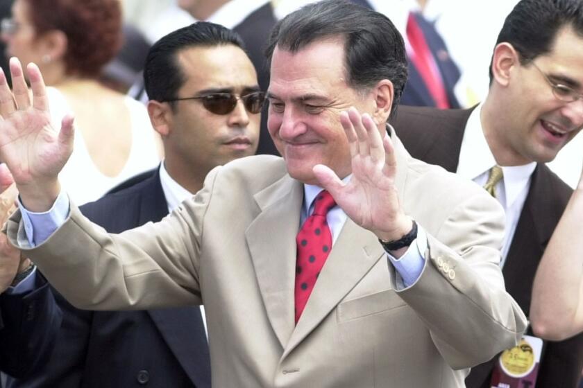 FILE - In this July 25, 2002 file photo, former Puerto Rican Gov. Rafael Hernández Colón waves to the crowd during a celebration at the Capitol in San Juan, Puerto Rico. Hernández Colón, who oversaw one of the U.S. territory's most prosperous periods, died on Thursday, May 2, 2019. He was 82. (AP Photo/Lynne Sladky, File)