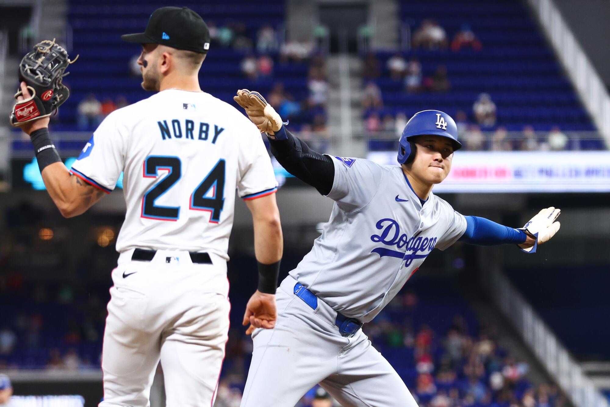 Shohei Ohtani reacts after his 50th stolen base of the season during the first inning Thursday.