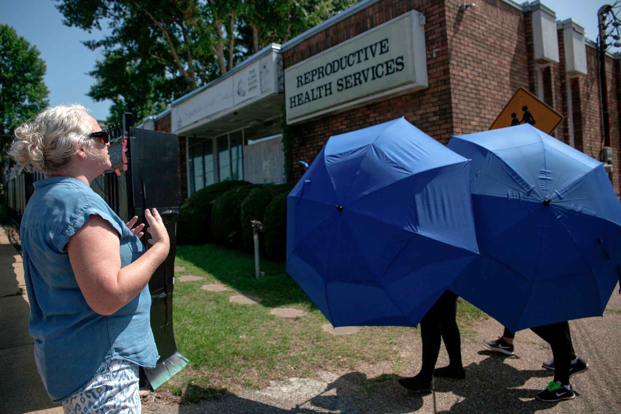 An antiabortion protester shouts as a woman is escorted into the Reproductive Health Services building in Montgomery, Ala.