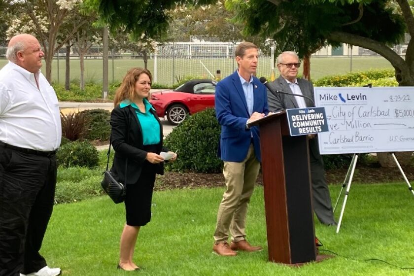 Councilmembers, from left, Peder Norby and Teresa Acosta, Rep. Mike Levin and Mayor Matt Hall announce a $5 million grant