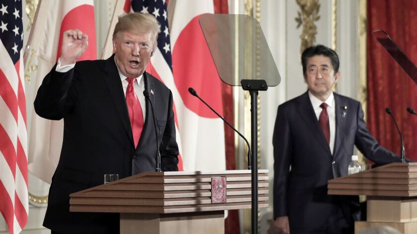 President Trump speaks at a news conference Monday with Japanese Prime Minister Shinzo Abe at Akasaka Palace in Tokyo.