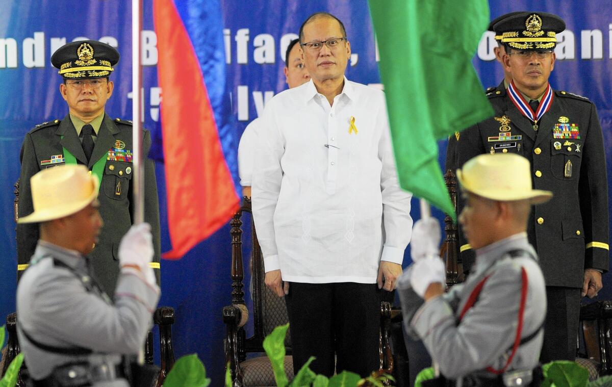 After a bungled raid in January, the government of Philippine President Benigno Aquino III, center, has delayed plans to give the U.S. wider access to military bases that the Obama administration sought for its strategic “pivot” to Asia.