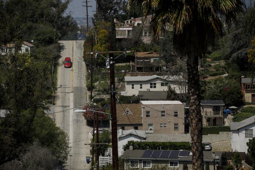 LOS ANGELES, CALIF. -- TUESDAY, APRIL 3, 2018: Baxter Street is one of the steepest streets in L.A. and the U.S., and is seeing lots of new drivers because of WAZE and other navigational apps that are routing drivers through the neighborhood in Los Angeles, Calif., on April 3, 2018. (Marcus Yam / Los Angeles Times)