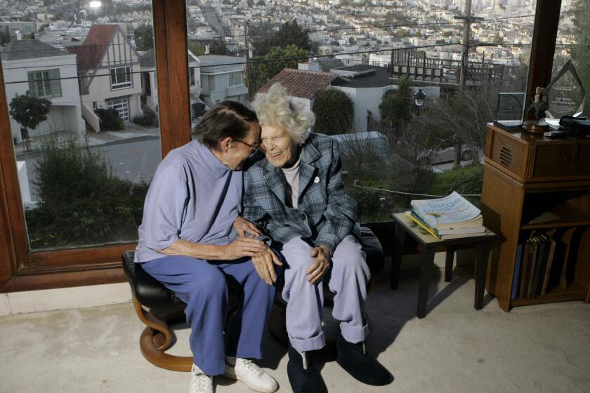 FILE - In this March 3, 2008, file photo, Phyllis Lyon, left, and Del Martin are photographed at home in San Francisco. The hilltop cottage of the couple that became the first same-sex partners to legally marry in San Francisco has become a city landmark. The San Francisco Board of Supervisors voted unanimously Tuesday, May 4, 2021, to give the 651 Duncan St. home of the lesbian activists landmark status. The home in the Noe Valley neighborhood is expected to become the first lesbian landmark in the western United States, the San Francisco Chronicle reported. (AP Photo/Marcio Jose Sanchez, file)