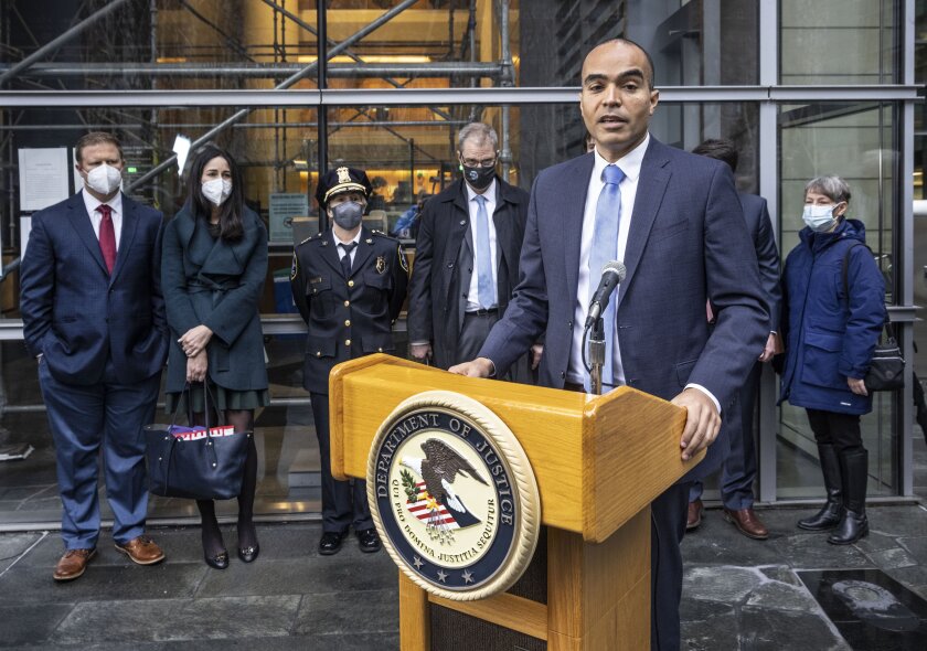 U.S. Attorney Nick Brown speaks on the steps of Federal Court, Tuesday, Jan. 11, 2022, in Seattle along with leadership from the FBI and Seattle Police Department about the Atomwaffen hate campaign following the sentencing of Kaleb Cole. (Steve Ringman/The Seattle Times via AP)