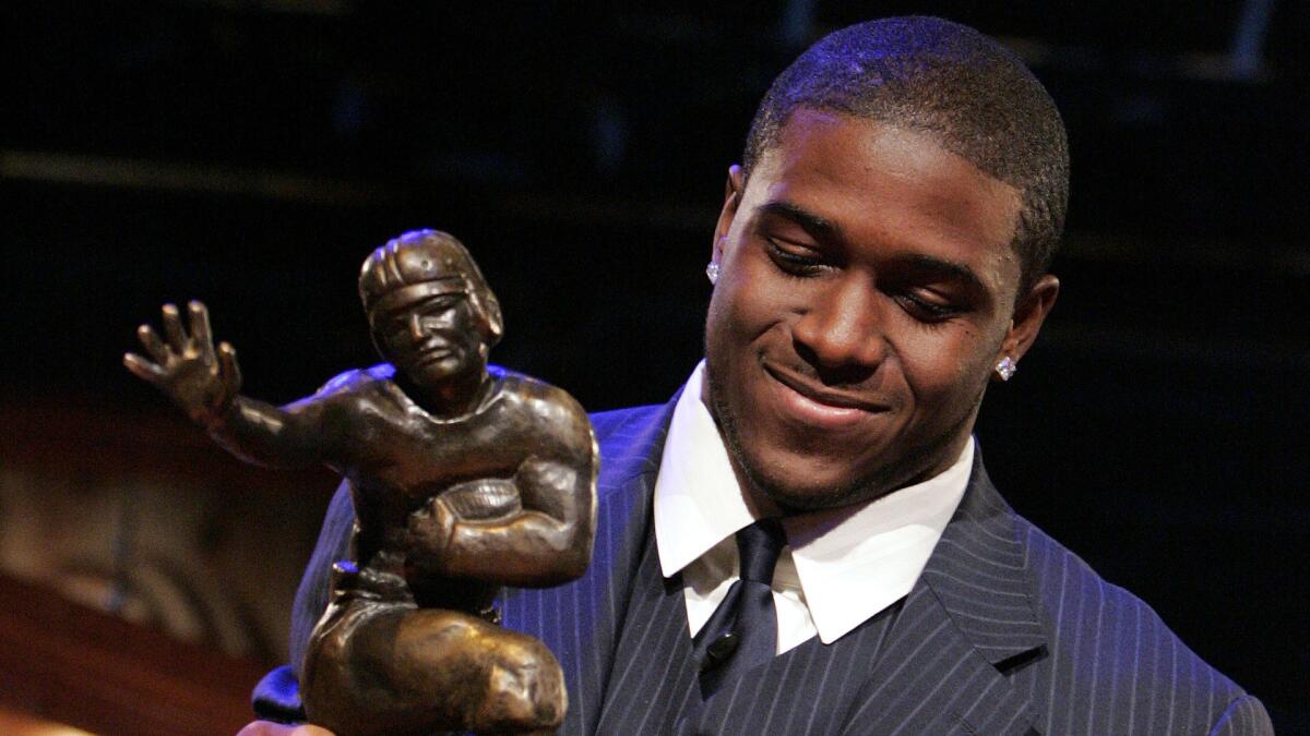 Former USC running back Reggie Bush forfeited his Heisman Trophy award after admitting to making "mistakes" during his time with the Trojans.
