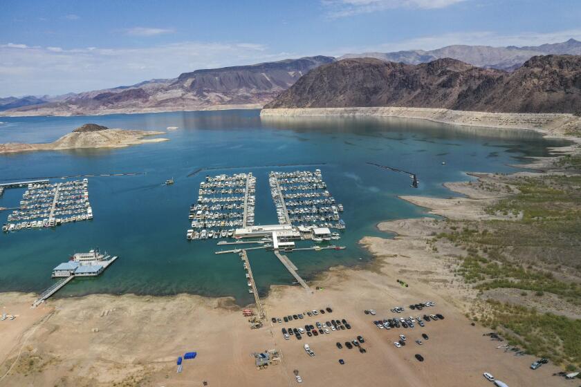 Lake Mead, NV - June 28: An aerial view of drought's effect at Hemenway Harbor, Lake Mead, which is at its lowest level in history since it was filled 85 years ago, Monday, June 28, 2021. The ongoing drought has made a severe impact on Lake Mead and a milestone in the Colorado River's crisis. High temperatures, increased contractual demands for water and diminishing supply are shrinking the flow into Lake Mead. Lake Mead is the largest reservoir in the U.S., stretching 112 miles long, a shoreline of 759 miles, a total capacity of 28,255,000 acre-feet, and a maximum depth of 532 feet. (Allen J. Schaben / Los Angeles Times)