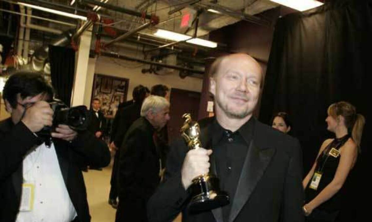 Paul Haggis is shown backstage at the Kodak Theatre in this 2006 photo after "Million Dollar Baby," for which he wrote the screenplay, won the Oscar for best picture.