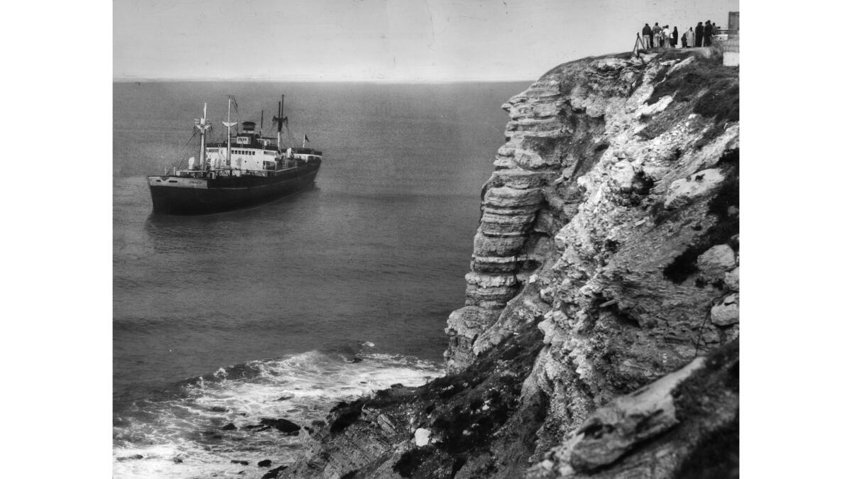 A shipwreck next to a bluff