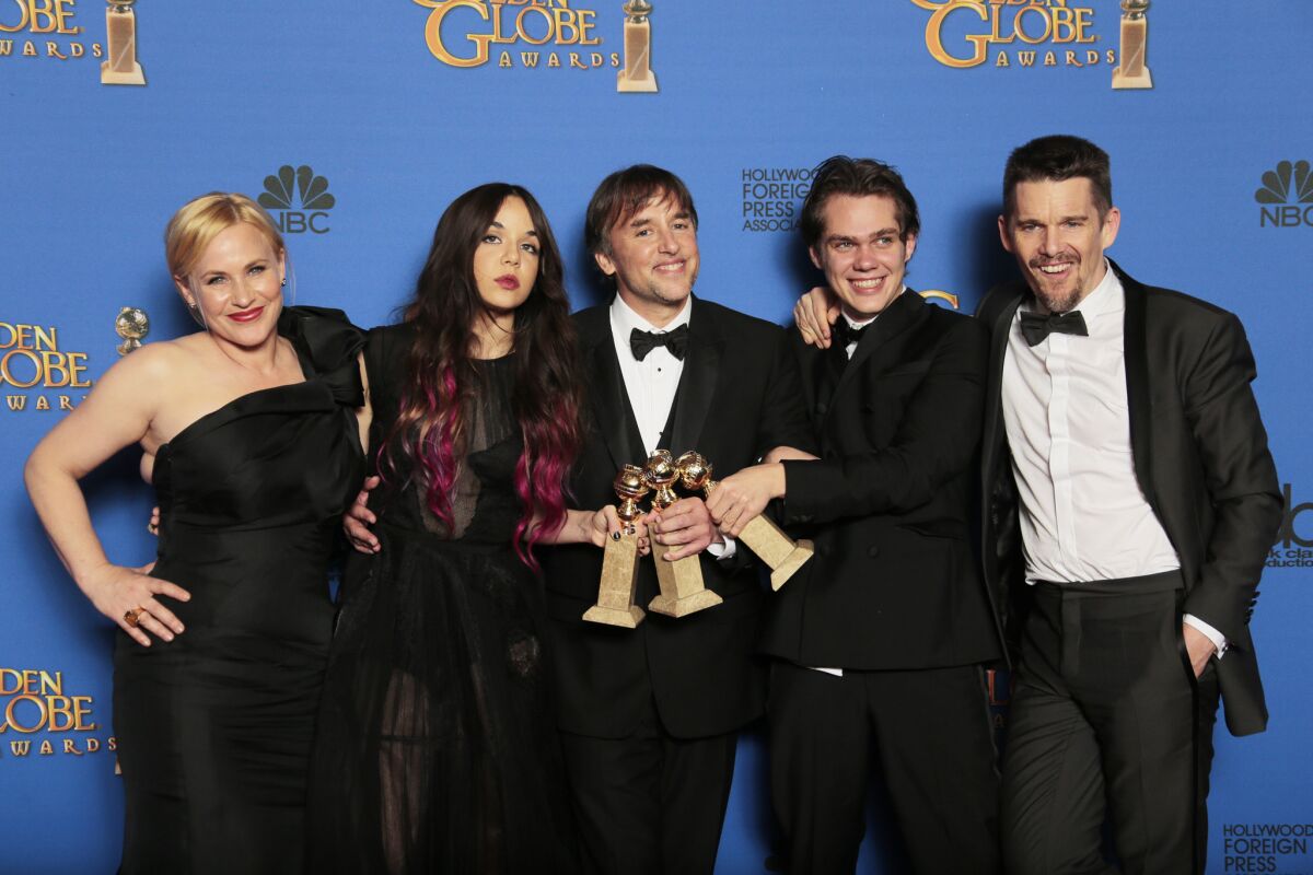 From left: Patricia Arquette, Lorelei Linklater, Richard Linklater, Ellar Coltrane and Ethan Hawke backstage after their motion picture drama win.