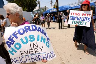 VENICE, CA - JULY 13, 2024 - Members of the CD11 Coalition for Human Rights and others protest to call on Mayor Karen Bass and other city leaders to intervene on behalf of the homeless who they feel are being criminalized, displaced, and banished from the Westside in Venice on July 13, 2024. Protesters said that they were upset with Los Angeles City Council Member Traci Park for blocking supportive housing, The Dell Project, and the upcoming closure of the Venice Bridge Home shelter for the homeless. (Genaro Molina/Los Angeles Times)