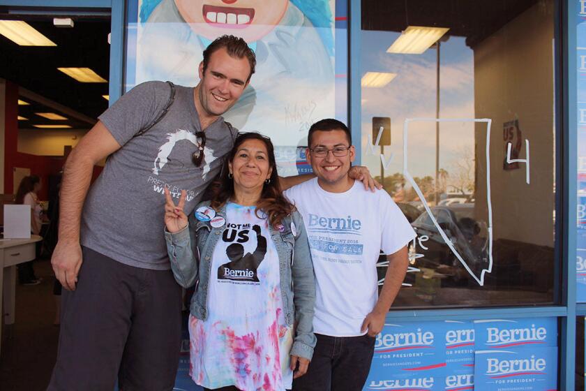 Yolanda Gonzalez, center, poses with fellow Californians and Bernie Sanders supporters James Albert, left, and Ronaldo Lizárraga-Angulo, right.
