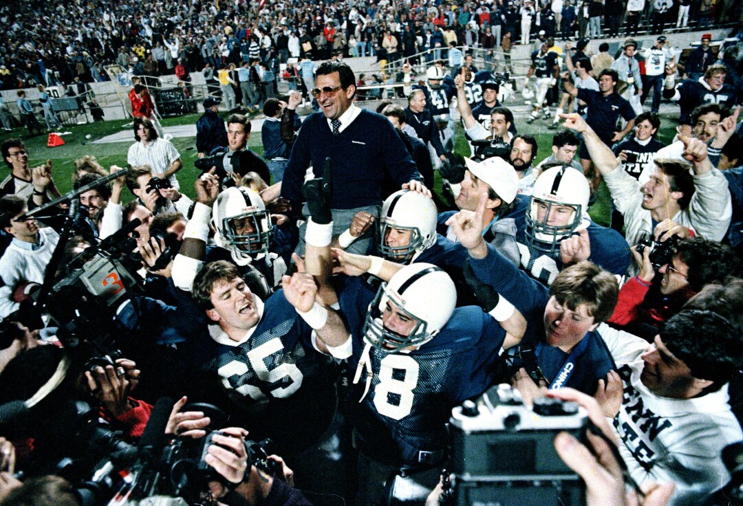 Penn State coach Joe Paterno is carried off the after the Nittany Lions defeated Miami in the Fiesta Bowl.