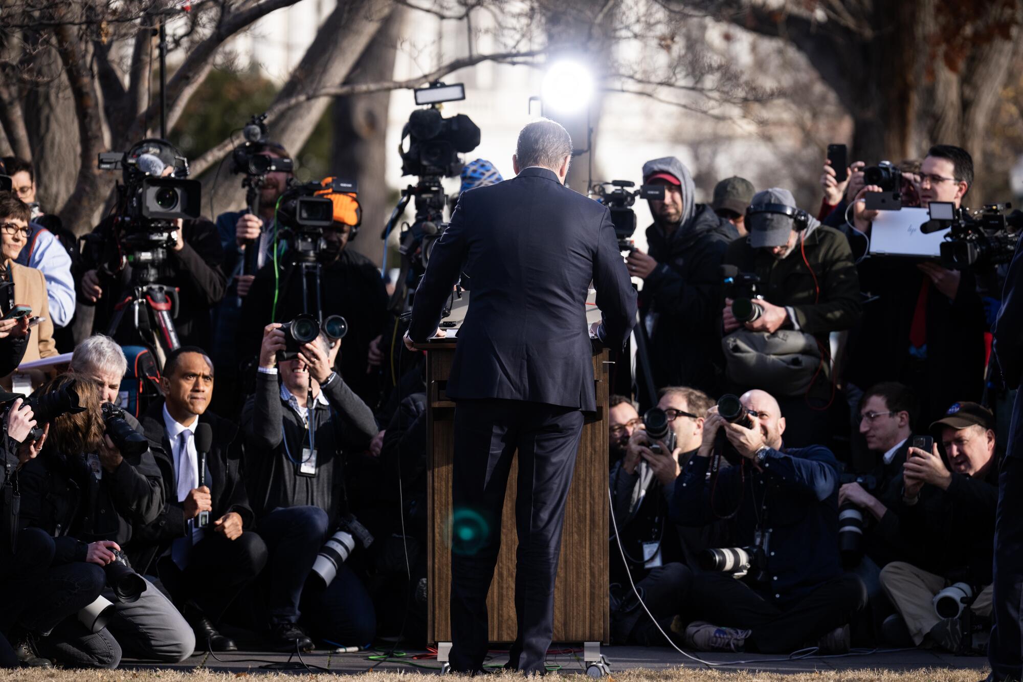 Media members gather at an outdoor Hunter Biden news conference